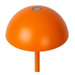 Pomarańczowa lampa stołowa Joy LED zewnętrzna, o zaokrąglonym kloszu i cienkiej nóżce. Klosz ma gładką, matową powierzchnię z centralnym przyciskiem, co podkreśla minimalistyczny design. Idealna do ogrodu lub na taras.