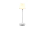 Martinez LED lampa stołowa zewnętrzna w kolorze białym, posiada okrągłą podstawę i cylindryczny klosz. Produkt stoi w pozycji pionowej, z delikatnym, ciepłym światłem, idealny do użytku w ogrodzie lub na tarasie.