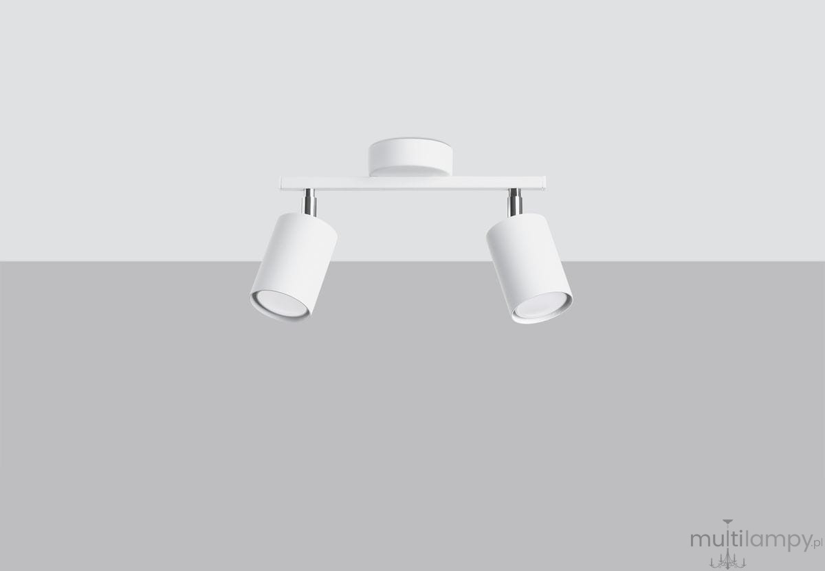 Lemmi lampa sufitowa (spot) 2-punktowa w kolorze białym, z dwiema cylindrycznymi głowicami na ruchomych ramionach. Montowana na suficie, z metalowym wykończeniem. Ujęcie frontalne na jasnym tle, pokazujące elegancki design lampy.