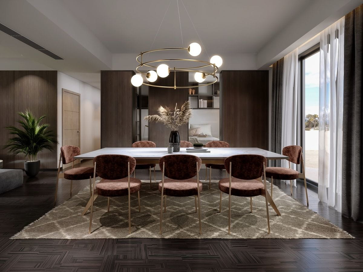 Lampa wisząca Balance 6-punktowa w kolorze złotym, zawieszona nad prostokątnym stołem. Okrągła konstrukcja z sześcioma kulistymi kloszami, w otoczeniu drewnianych mebli i roślinności, tworzy nowoczesną aranżację jadalni.