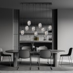 Lampa wisząca Astral 9-punktowa w kolorze czarnym i grafitowym, z przezroczystymi kloszami, zawieszona na długich linkach. Ujęcie frontalne, w tle nowoczesna kuchnia z minimalistycznym stołem i krzesłami.