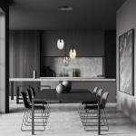 Lampa wisząca Astral 3-punktowa w kolorze czarnym z multikolorowymi kloszami, zawieszona na długich kablach, w nowoczesnej kuchni. W tle widoczne szare meble i stół z czarnymi krzesłami.