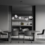 Lampa wisząca Pandora 6-punktowa w kolorze czarnym i grafitowym. Oświetlenie z sześcioma okrągłymi kloszami, zawieszona nad okrągłym stołem w nowoczesnym wnętrzu. Tło z szarymi ścianami i minimalistycznym wyposażeniem.