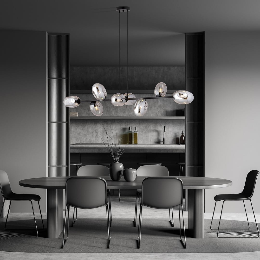 Lampa wisząca Pandora 8-punktowa w kolorze czarnym i grafitowym, z szklanymi kloszami o owalnym kształcie, zawieszona nad okrągłym stołem w nowoczesnej jadalni. Tło w odcieniach szarości z minimalistycznym wystrojem.