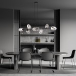 Lampa wisząca Pandora 8-punktowa w kolorze czarnym i grafitowym, z szklanymi kloszami o owalnym kształcie, zawieszona nad okrągłym stołem w nowoczesnej jadalni. Tło w odcieniach szarości z minimalistycznym wystrojem.