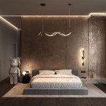 Czarna i złota lampa wisząca Tau LED z trzema punktami świetlnymi, umieszczona nad łóżkiem w nowoczesnej sypialni. Lampa ma falisty kształt, zawieszona na cienkich linkach w minimalistycznym wnętrzu z brązowymi ścianami i drewnianą podłogą.