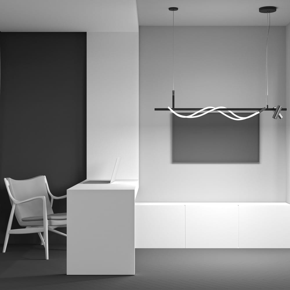 Tau LED lampa wisząca 3-punktowa w kolorze czarnym i złotym, z nowoczesnym designem. Zawieszona nad białym biurkiem w minimalistycznym wnętrzu, z asymetrycznym kształtem i prostymi liniami. Tło w odcieniach szarości podkreśla elegancję lampy.