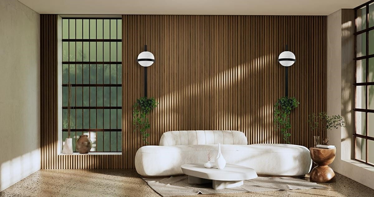 Kinkiet LED Plant Wall w kolorze czarnym, z okrągłą, białą oprawą, zamontowany na drewnianej ścianie. W tle widoczna jasna, nowoczesna sofa oraz rośliny, co tworzy przytulny klimat wnętrza.