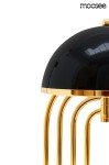 Lampa stołowa Bottega 2-punktowa w kolorze złotym i czarnym, z okrągłym, błyszczącym kloszem oraz złotymi, metalowymi nóżkami w formie cienkich prętów. Ujęcie z boku, ukazujące detale konstrukcji i wykończenia.
