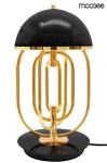 Lampa stołowa Bottega z dwoma punktami świetlnymi, złota z czarnym kloszem. Posiada okrągłą podstawę oraz metalowe, złote elementy w formie cienkich rur. Klosz w kształcie półkuli, gładka powierzchnia, elegancki design.