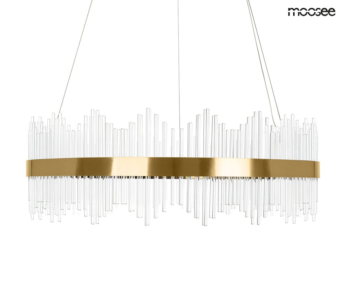 Lampa wisząca Florens 80 LED w złotym kolorze, z przezroczystymi, szklanymi prętami. Ujęcie z boku, ukazujące okrągłą, elegancką konstrukcję z metalowym obręczami. Idealna do nowoczesnych wnętrz, wisi na cienkich linkach.