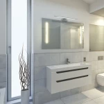 Kinkiet Shine LED IP44 w kolorze chromu, 1-punktowy, o długości 40 cm i mocy 7 W, zamontowany nad lustrem w nowoczesnej łazience. Światło ma formę prostokątnego, minimalistycznego elementu, idealnego do oświetlenia wnętrza.