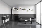 Lampa wisząca Rossi, 8-punktowa, w kolorze czarnym i transparentnym, z okrągłymi kloszami. Zawieszona nad szarym, nowoczesnym sosem w minimalistycznym wnętrzu. Oświetlenie w stylu industrialnym, idealne do przestrzeni mieszkalnych.