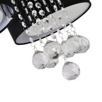 Lampa sufitowa Gambela 3xE27 w kolorze czarnym, z ozdobnymi kryształowymi wiszącymi elementami. Widoczne są transparentne, wielościenne kule oraz błyszczące łańcuszki, które dodają elegancji. Produkt zawieszony w górnej części, z ciemnym abażurem.