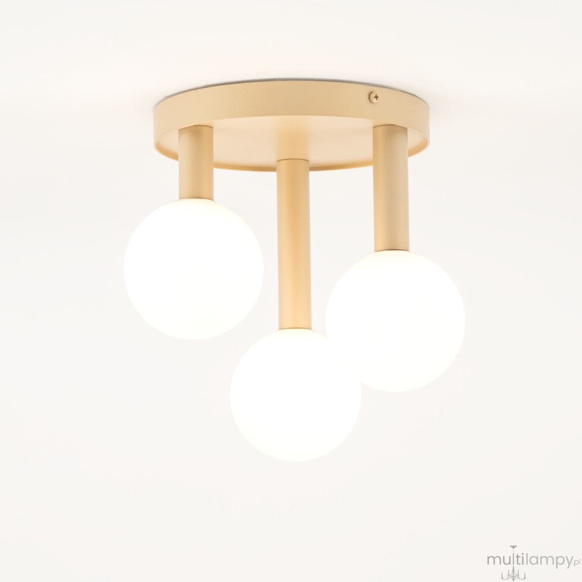 Lampa sufitowa Perla 3xG9 w kolorze złotym i białym, z okrągłym, płaskim stelażem oraz trzema kulistymi kloszami emitującymi białe światło. Produkt zamontowany na suficie, widoczny z dołu.