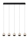 Lampa wisząca Sentubal z pięcioma szklanymi kloszami w kolorze czarnym, zawieszona na cienkich linkach. Klosze mają okrągły kształt z przezroczystą górą i czarną dolną częścią. Umożliwia oświetlenie przestrzeni w nowoczesnym stylu.