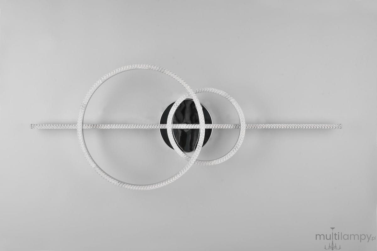 Montilla lampa sufitowa z pilotem, o chromowanej konstrukcji, zawiera trzy okrągłe elementy LED. Ujęcie z góry, ukazujące minimalistyczny design z czarnym centralnym mocowaniem oraz przezroczystymi detalami w kształcie okręgów.