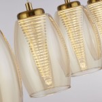 Lampa wisząca Cyclone 4xLED/22W w brązowych i bursztynowych kloszach. Klosze o cylindrycznym kształcie z delikatnymi żłobieniami, zawieszone na metalowej podstawie w kolorze złotym. Oświetlenie stwarza ciepłą atmosferę.