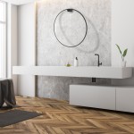 Kinkiet Saturno D80 w kolorze czarnym, z jedną diodą LED o mocy 46W, zamontowany na ścianie. Produkt prezentuje nowoczesny design, idealny do wnętrz. Tło stanowi minimalistyczna aranżacja z betonową ścianą i białymi meblami.