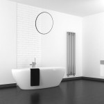 Czarna lampa wisząca Saturno D80 z jedną diodą LED o mocy 46W, IP44, zawieszona nad wanną. Okrągły kształt, minimalistyczny design, w nowoczesnej aranżacji łazienki z białymi ścianami i ciemną podłogą.