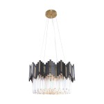 Lampa wisząca Rotta z sześcioma gniazdami E14, w kolorze złotym i czarnym. Okrągła podstawa z metalicznym wykończeniem, otoczona dekoracyjnymi, szklanymi elementami w formie prostokątów. Długo wiszące przewody. Tło białe.