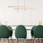 Lampa wisząca Edge 4xLED/42W w kolorze czarnym i złotym, zawieszona nad stołem w nowoczesnej kuchni. Kąt ujęcia z boku, ukazujący minimalistyczny design i prostokątne elementy świetlne. W tle zielone krzesła z metalowymi nogami.