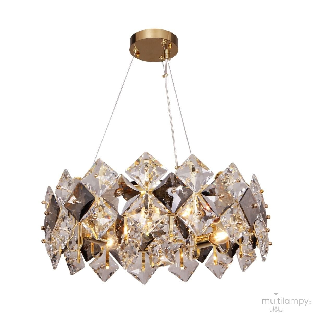 Lampa wisząca Tiara w kolorze złotym z sześcioma oprawami E14. Klosz wykonany z diamentowych, przezroczystych kryształów, podwieszony na cienkich żyłkach. Górna część z metalowego, złotego wykończenia.