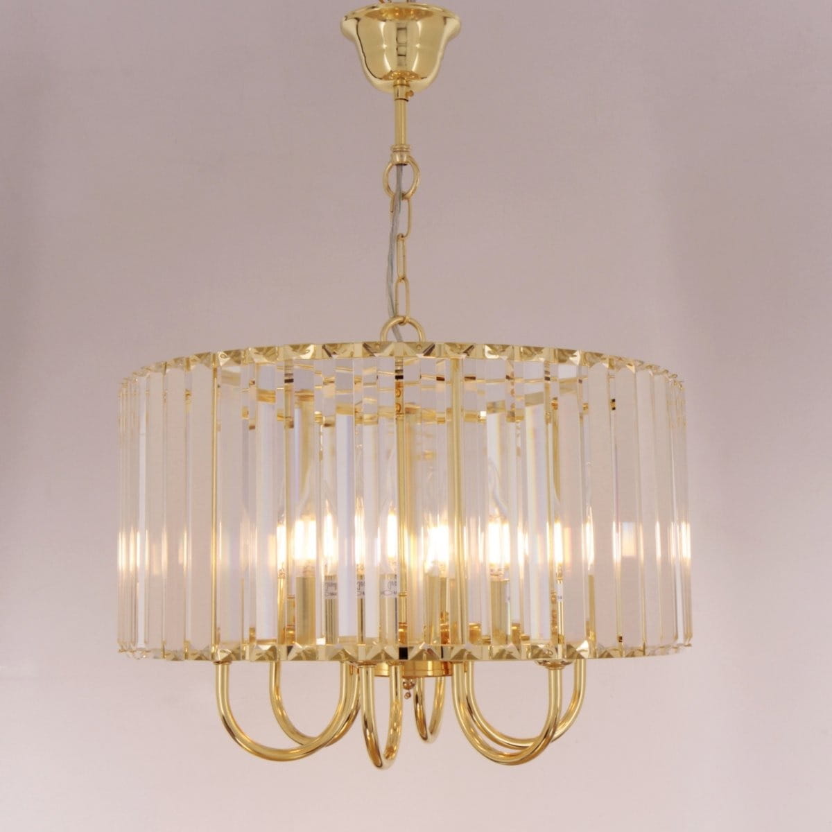 Lampa wisząca Paris 1906/6 w kolorze złotym, z sześcioma źródłami światła typu E14. Okrągła konstrukcja z przezroczystymi elementami, zawieszona na złotej łańcuszku. Stylowy design z metalowymi detalami.