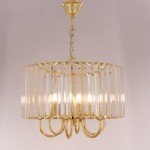 Lampa wisząca Paris 1906/6 w kolorze złotym, z sześcioma źródłami światła typu E14. Okrągła konstrukcja z przezroczystymi elementami, zawieszona na złotej łańcuszku. Stylowy design z metalowymi detalami.