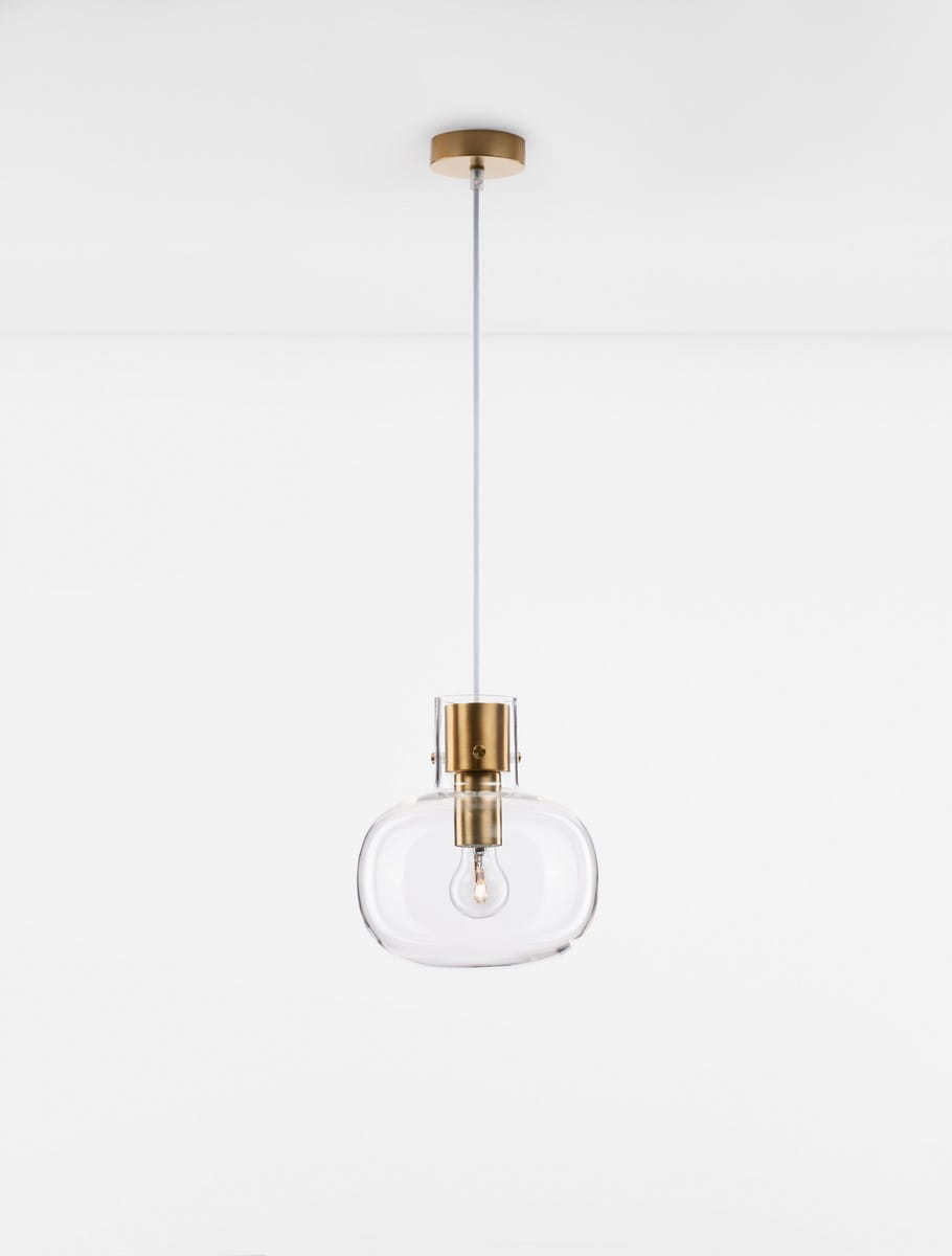 Lampa wisząca Padre 1xE27 w kolorze złotym z przezroczystym kloszem w kształcie owalnym. Montowana na białym przewodzie, zawieszona na złotym elemencie na suficie. Idealna do nowoczesnych aranżacji wnętrz.