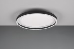 Plafon Rotonda 1xLED/20W w kolorze czarnym, okrągły, zamontowany na suficie. Posiada białą, matową klosz, który zapewnia równomierne oświetlenie. Widoczny jest kontrast między czarną obwódką a białą powierzchnią. Tło w odcieniach szarości.