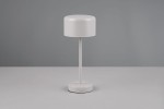Lampa stołowa Jeff w kolorze szarym z metalowym stelażem, o okrągłej podstawie i cylindrycznym kloszu. Ujęcie frontalne, stojąca na jednolitym tle. Widoczny przycisk włącznika na podstawie. Wbudowane źródło światła LED o mocy 1,5W.