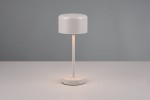 Lampa stołowa Jeff w kolorze szarym, z okrągłą podstawą i cylindrycznym kloszem. Ujęcie frontalne, lampa stoi na płaskiej powierzchni. Widoczny przycisk na podstawie do włączania. Źródło światła LED o mocy 1,5W.
