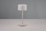 Lampa stołowa Jeff w kolorze szarym, z okrągłym kloszem i prostą, metalową nogą. Ustawiona na płaskiej powierzchni, z widocznym przyciskiem włączania na podstawie. Klosz ma gładką, matową fakturę.