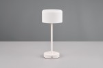 Lampa stołowa Jeff z białym kloszem, stojąca na okrągłej podstawie z widocznym przyciskiem włączania. Prosty, nowoczesny design, idealna do biura lub salonu. Ujęcie frontalne na jednolitym tle.