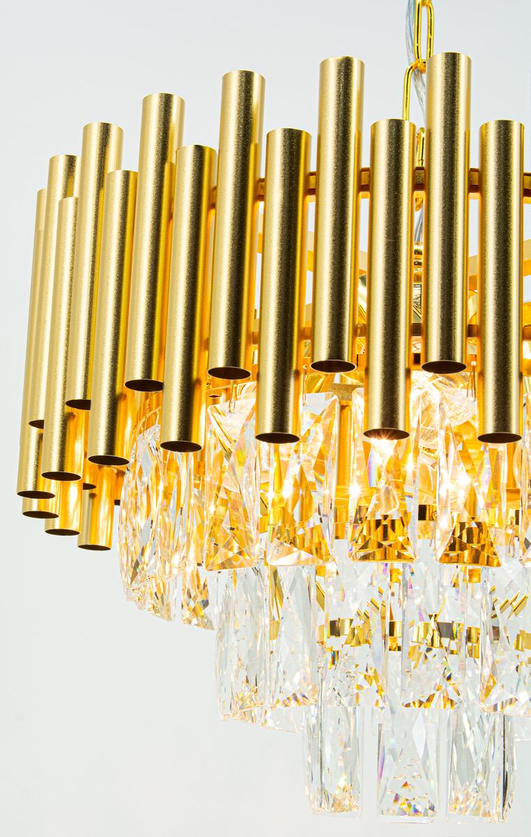 Lampa wisząca Bari 4xE27 w kolorze złotym, z metalowymi rurkami i kryształowymi elementami. Ujęcie z góry, ukazujące szczegóły konstrukcji i efekty świetlne. Wymiary i dodatkowe detale nie są widoczne.