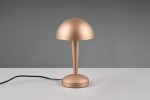 Lampa stołowa Canaria w kolorze brązowym z kloszem w kształcie półkuli i smukłym trzonem. Ustawiona na płaskiej powierzchni, z widocznym kablem zasilającym. Wykonana z matowego materiału, prezentująca nowoczesny design.