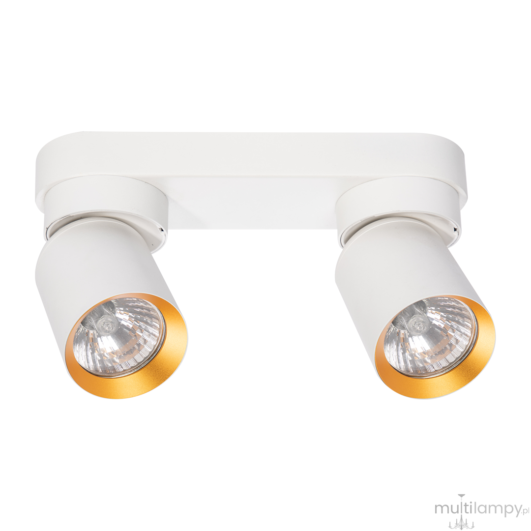 Lampa sufitowa Andy z dwoma punktami świetlnymi, biała z złotymi akcentami. Kształt cylindryczny, zamontowana na prostokątnej podstawie. Ujęcie frontalne, z widocznymi detalami reflektorów.