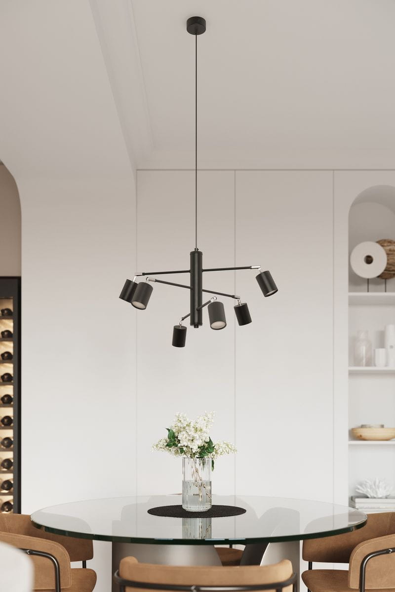Lemmi lampa wisząca 6xGU10 w kolorze czarnym, z sześcioma ruchomymi kloszami, zawieszona na cienkim przewodzie. Produkt umieszczony nad okrągłym, szklanym stołem, w jasnym wnętrzu z minimalistycznym tłem.