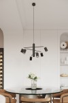 Lemmi lampa wisząca 6xGU10 w kolorze czarnym, z sześcioma ruchomymi kloszami, zawieszona na cienkim przewodzie. Produkt umieszczony nad okrągłym, szklanym stołem, w jasnym wnętrzu z minimalistycznym tłem.