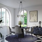 Lampa wisząca Yoli w kolorze czarnym, zawierająca pięć opraw na żarówki G9. Produkt zawieszony na cienkich, czarnych linkach, umieszczony w nowoczesnej aranżacji jadalni z okrągłym stołem i krzesłami w kratkę.