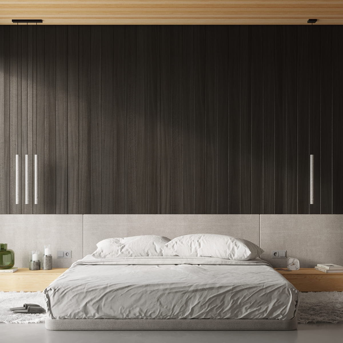 Lampa wisząca Pastelo 1xG9 w kolorze czarnym i betonowym, o minimalistycznym designie, zawieszona w nowoczesnej sypialni. Widoczna obok łóżka z jasną pościelą oraz drewnianym stolikiem nocnym. Tło w odcieniach ciemnego drewna i betonu.