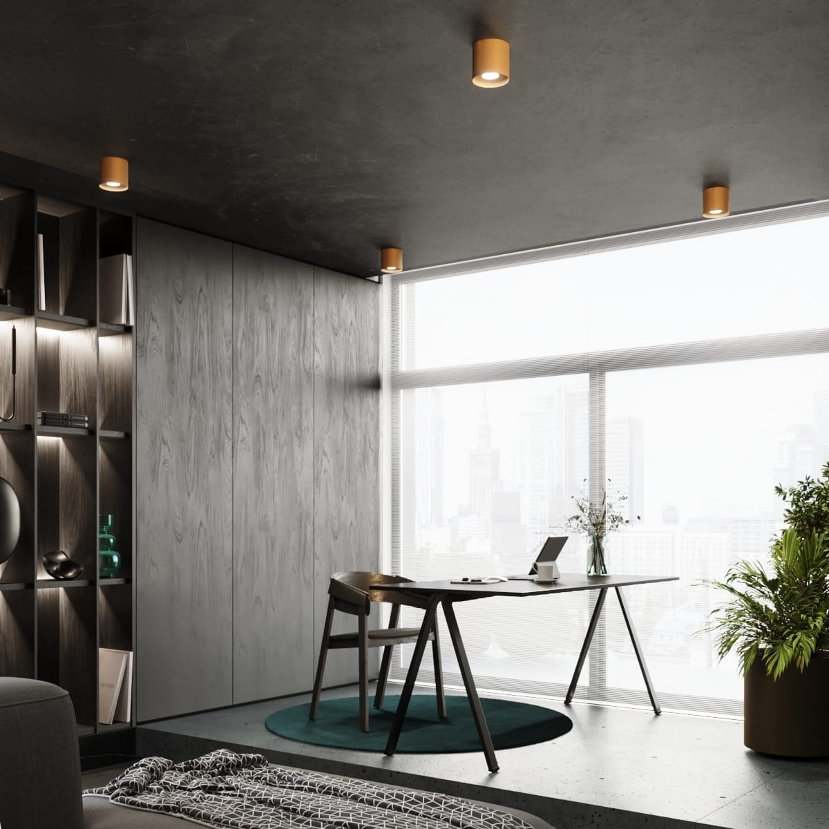 Lampa sufitowa Mika 1xGU10 w kolorze złotym, zamontowana na ciemnym suficie. W tle widoczna przestrzeń biurowa z drewnianymi panelami, biurkiem i rośliną, zapewniająca nowoczesny kontekst użytkowania.