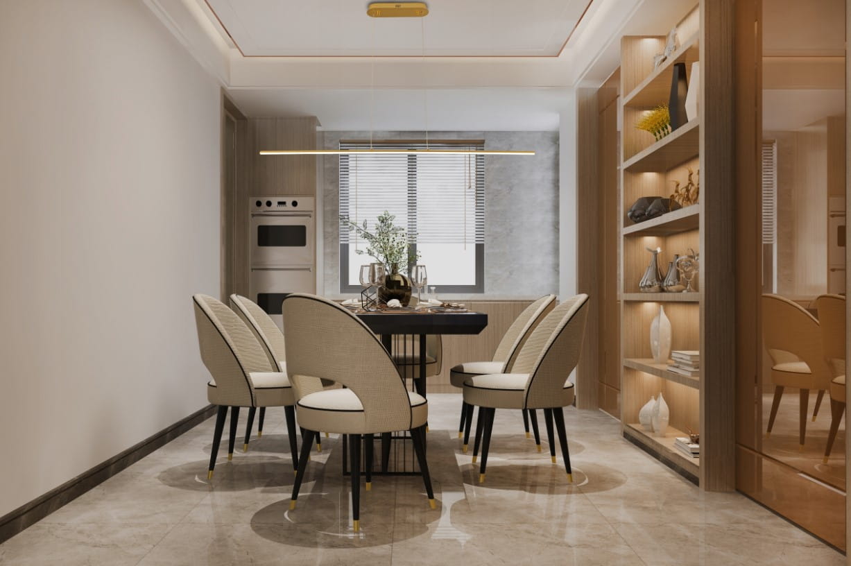 Lampa wisząca Kiki w kolorze złotym, zamontowana na suficie, z jednym źródłem światła LED o mocy 20W. Prosty, minimalistyczny design, umieszczona nad stołem w nowoczesnej jadalni. Otoczona eleganckimi krzesłami i dekoracjami w tle.