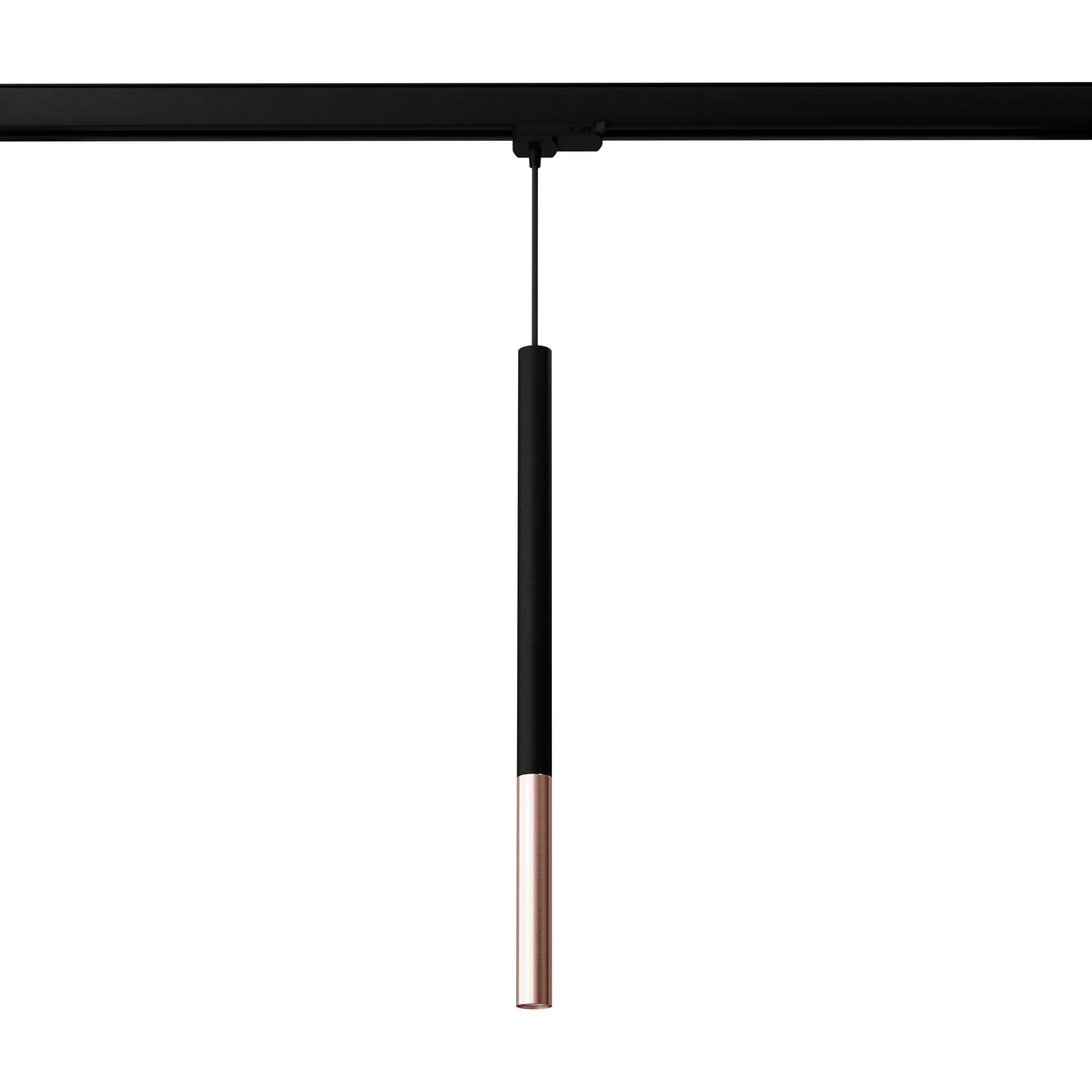Lampa wisząca Mozaica 1xG9 w kolorze czarnym z miedzianym akcentem, zawieszona na szynie 3F. Prosty, cylindryczny kształt z matowym wykończeniem. Widoczna żarówka LED 4,5W/4000K na końcu lampy.