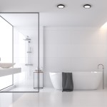 Plafon LED Vera D18 w kolorze czarnym, o mocy 12W i barwie światła 4000K, zamontowany w nowoczesnej łazience. Ujęcie z góry, podkreślające minimalistyczny design oraz zastosowanie w przestrzeni o białych płytkach i dużych oknach.