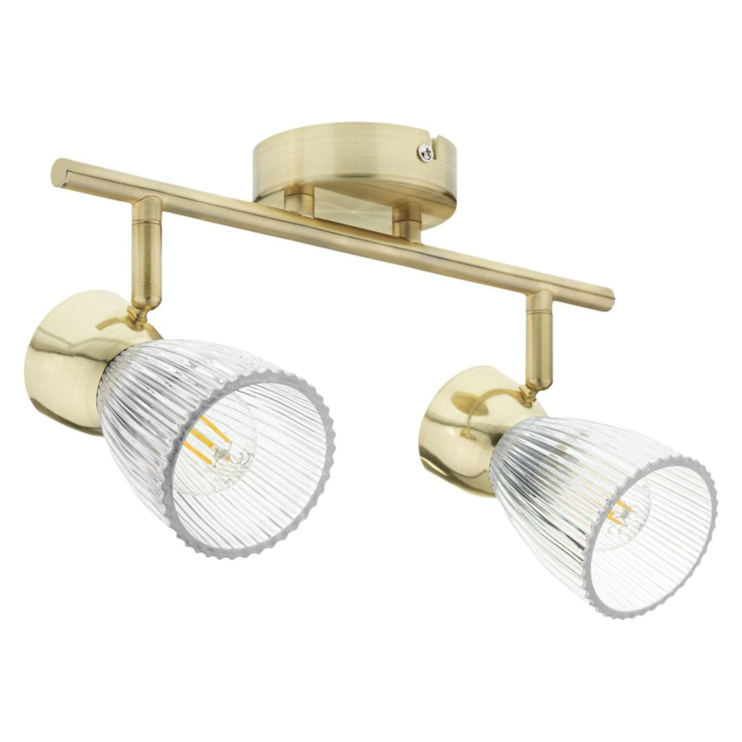 Lampa sufitowa typu spot z dwoma źródłami światła E14. Konstrukcja w kolorze złotym z przezroczystymi kloszami o żłobionej fakturze. Umożliwia skierowanie światła w wybrane miejsca, zamontowana na okrągłej podstawie.