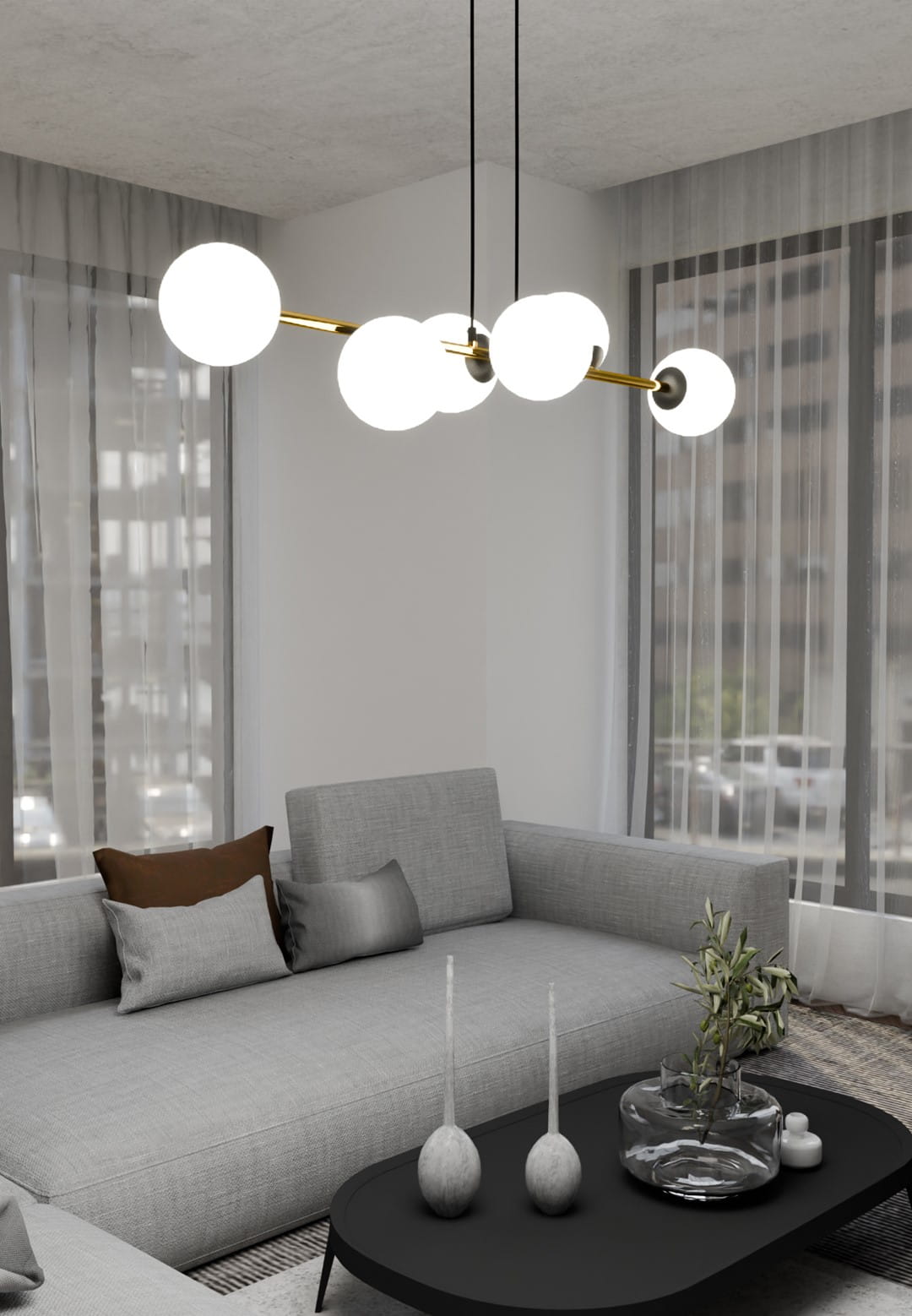 Lampa wisząca Gravity 6-punktowa z czarnymi i złotymi detalami, z opalowymi kulami. Zawieszona nad szarym narożnikiem w nowoczesnym wnętrzu. Kule równomiernie rozmieszczone na długiej, złotej rurze, tworzą elegancką kompozycję.