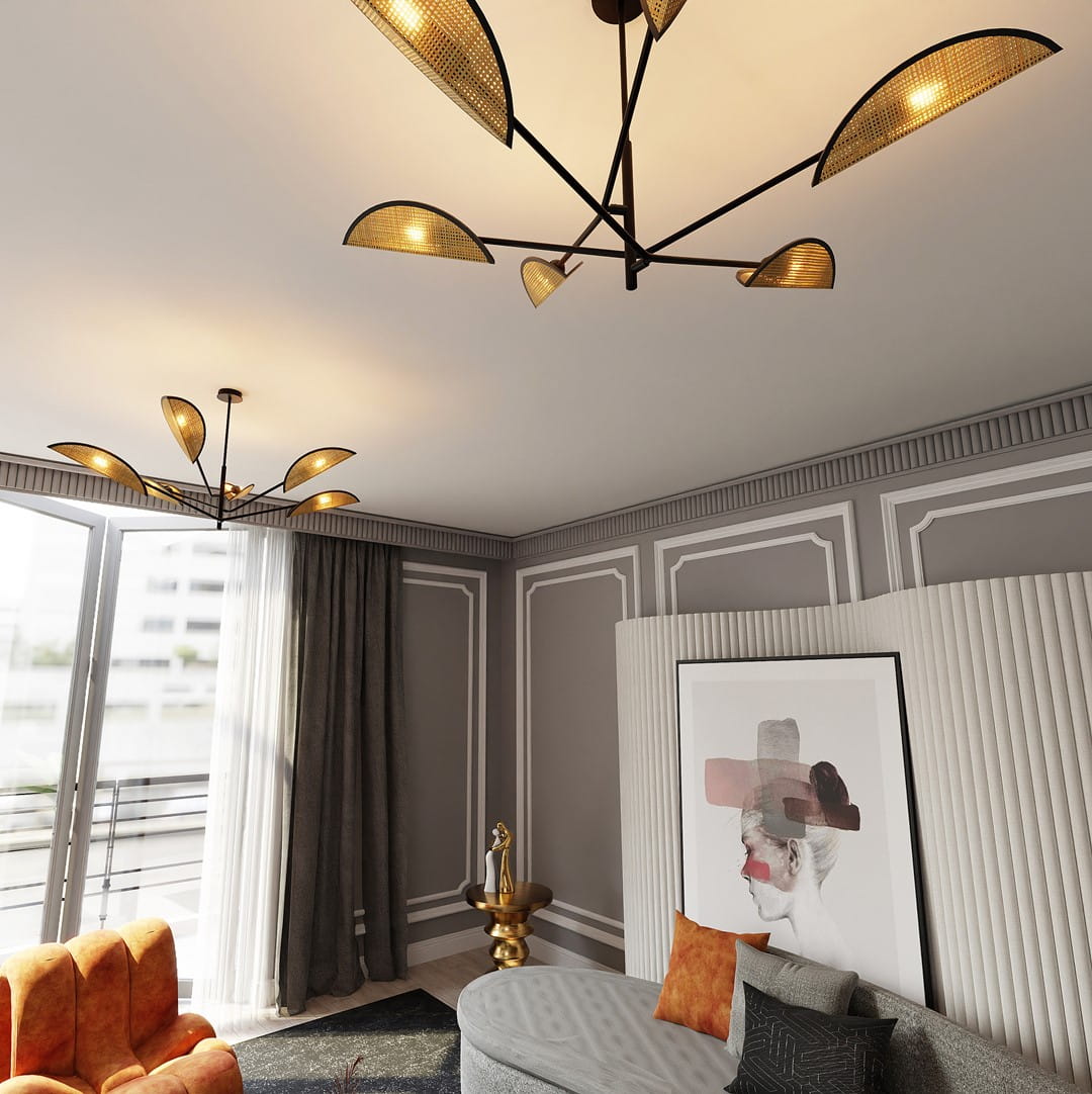 Lampa sufitowa Vene 6-punktowa w kolorze czarnym z rattanowymi abażurami, zamontowana na suficie. Widoczne sześć źródeł światła w kształcie półokręgów, w nowoczesnym wnętrzu z szarymi ścianami i dekoracyjnymi elementami.