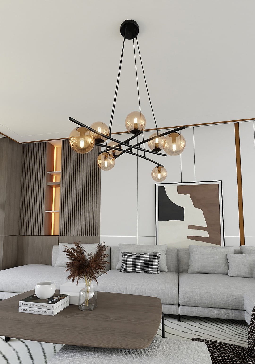 Lampa wisząca Essa, 8-punktowa, w kolorze czarnym z miodowymi kloszami, zawieszona na cienkich linkach. Ujęcie z dołu, ukazujące elegancki design z wieloma okrągłymi żarówkami. Tło to nowoczesne wnętrze z szarym narożnikiem i dekoracjami.